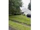 View of the home from the yard, highlighting the two-car garage at 4404 London Ct, Indianapolis, IN 46254
