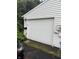 A white garage door, mailbox, and exterior electrical meter at 4404 London Ct, Indianapolis, IN 46254