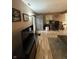 Spacious living room with wood laminate flooring, furniture, and natural light at 4404 London Ct, Indianapolis, IN 46254