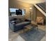 Cozy living room with a couch, coffee table, and stairway access at 4404 London Ct, Indianapolis, IN 46254