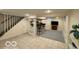 Finished basement with access to the staircase, with a bar and entertainment area at 4405 Primrose Ave, Indianapolis, IN 46205