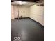 Unfinished basement featuring painted floor, white walls, and utilities at 4405 Primrose Ave, Indianapolis, IN 46205