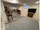 Finished basement featuring a bar area, tiled floor, and a cozy, functional space at 4405 Primrose Ave, Indianapolis, IN 46205
