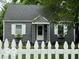Charming single-story home with grey siding, white trim, and a welcoming front porch at 4405 Primrose Ave, Indianapolis, IN 46205