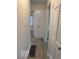 Hallway leading to bedroom with updated wood-look flooring at 4405 Primrose Ave, Indianapolis, IN 46205
