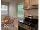 Eat-in kitchen area with stainless steel appliances and natural light at 4405 Primrose Ave, Indianapolis, IN 46205