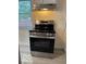 Modern stainless steel gas range in a bright kitchen with light-colored flooring at 4405 Primrose Ave, Indianapolis, IN 46205