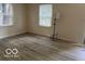 Bright living room with updated flooring and natural light at 4405 Primrose Ave, Indianapolis, IN 46205
