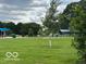 View of community park featuring green space, playground, and shaded seating areas at 4405 Primrose Ave, Indianapolis, IN 46205