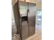 Stainless steel refrigerator with water dispenser, complemented by light-colored walls and trim at 4405 Primrose Ave, Indianapolis, IN 46205