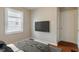 Cozy bedroom with mounted television, combining comfort and modern entertainment at 4517 E 16Th St, Indianapolis, IN 46201