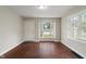 Bright living room featuring hardwood floors, a large window, and neutral paint, ready for personalization at 4517 E 16Th St, Indianapolis, IN 46201