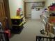 View of a basement used as a play area with laminate flooring and neutral colored walls at 4521 Tulip N Dr, Martinsville, IN 46151