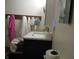 A half bathroom with single sink vanity and towel rack at 4521 Tulip N Dr, Martinsville, IN 46151