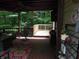 Beautiful deck with furniture and decor with surrounding trees at 4521 Tulip N Dr, Martinsville, IN 46151