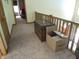Hallway with carpet and a railing plus furniture and boxes randomly placed at 4521 Tulip N Dr, Martinsville, IN 46151