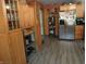 A kitchen with stainless steel appliances, wood cabinets and vinyl flooring at 4521 Tulip N Dr, Martinsville, IN 46151