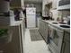 Efficient kitchen design with white appliances, gray cabinets, and lots of space at 4521 Tulip N Dr, Martinsville, IN 46151