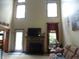 Bright living room with a fireplace, large windows, and comfortable seating at 4521 Tulip N Dr, Martinsville, IN 46151