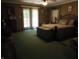Serene primary bedroom with a king-sized bed, walkout doors, and soft natural light at 4521 Tulip N Dr, Martinsville, IN 46151
