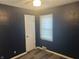 Bedroom showing laminate floors and natural light from window at 4723 Crittenden Ave, Indianapolis, IN 46205