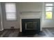 Cozy living room featuring a fireplace and windows at 4723 Crittenden Ave, Indianapolis, IN 46205