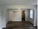 View of the spacious living room showcasing hardwood floors with archway to the kitchen at 4723 Crittenden Ave, Indianapolis, IN 46205