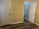 A room featuring a modern door and wood-look flooring at 4723 Crittenden Ave, Indianapolis, IN 46205