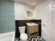 Contemporary bathroom featuring a modern vanity, decorative tile, and updated fixtures at 5115 Primrose Ave, Indianapolis, IN 46205