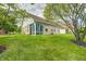 Brick house with well-maintained lawn, enclosed porch, and mature shade trees at 5217 Dunewood Way # 3002, Avon, IN 46123