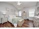 Inviting bedroom boasts vaulted ceiling, wood floors, and neutral decor at 5217 Dunewood Way # 3002, Avon, IN 46123