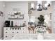 Dining area with coffee bar, open floor plan, and a view into the living room at 5217 Dunewood Way # 3002, Avon, IN 46123