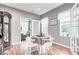 Dining area with a table set for four, bathed in natural light, and views of the backyard at 5217 Dunewood Way # 3002, Avon, IN 46123
