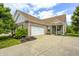 Charming brick home with two-car garage, landscaped front yard, and covered porch at 5217 Dunewood Way # 3002, Avon, IN 46123