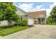 Charming single-story home with a brick facade, attached garage, and well-manicured lawn at 5217 Dunewood Way # 3002, Avon, IN 46123