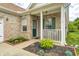 Charming home featuring a brick facade, manicured landscaping, and a welcoming front porch at 5217 Dunewood Way # 3002, Avon, IN 46123