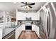 Modern kitchen with stainless steel appliances, granite countertops, and wood flooring at 5217 Dunewood Way # 3002, Avon, IN 46123