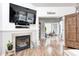 Comfortable living room showcasing a fireplace and seamless transition to the dining room at 5217 Dunewood Way # 3002, Avon, IN 46123