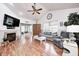 Spacious living room with high ceilings, fireplace, and open layout to the dining area at 5217 Dunewood Way # 3002, Avon, IN 46123
