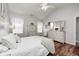 Spacious main bedroom featuring light walls, wood floors, and ample natural light at 5217 Dunewood Way # 3002, Avon, IN 46123