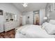 Bright main bedroom with vaulted ceiling, light walls, and stylish wood floors at 5217 Dunewood Way # 3002, Avon, IN 46123