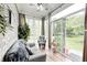 Relaxing sunroom with ample windows, comfortable seating, and peaceful garden views at 5217 Dunewood Way # 3002, Avon, IN 46123