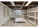 Basement laundry room with utility sink, washer, dryer, and storage at 6030 Evanston Ave, Indianapolis, IN 46220