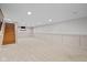Large finished basement with recessed lighting and painted walls at 6030 Evanston Ave, Indianapolis, IN 46220