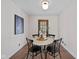 Cozy dining area featuring a round table, seating for four, and dark wood accents at 6030 Evanston Ave, Indianapolis, IN 46220