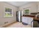 Bright kitchen with wood countertops, stainless steel fridge and sunny window at 6030 Evanston Ave, Indianapolis, IN 46220