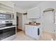 Cozy kitchen nook with butcher block counters and white cabinets at 6030 Evanston Ave, Indianapolis, IN 46220