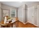 Well-lit office space showcasing hardwood floors and built-in storage at 6030 Evanston Ave, Indianapolis, IN 46220