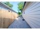 This home has a private backyard featuring a wooden fence and easy-to-maintain gravel landscaping at 608 Manhattan Ave, Indianapolis, IN 46241