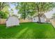 Spacious backyard featuring a storage shed and a newly installed wooden fence at 608 Manhattan Ave, Indianapolis, IN 46241